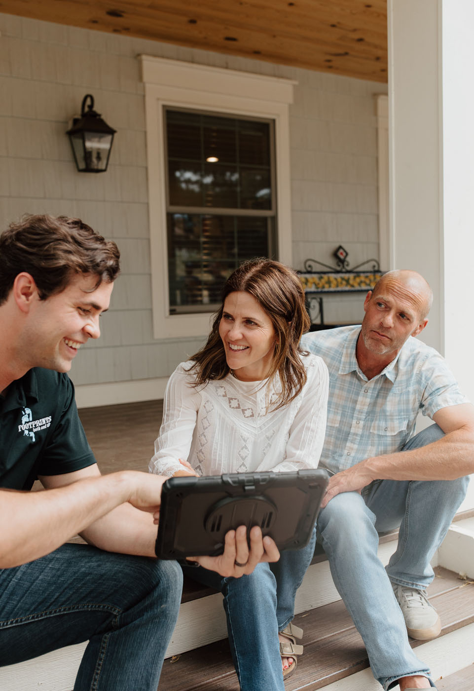 A Footprints Bath and Tile professional working with homeowners - Footprints Bath and Tile is your go-to Columbus bathroom tiling contractor.