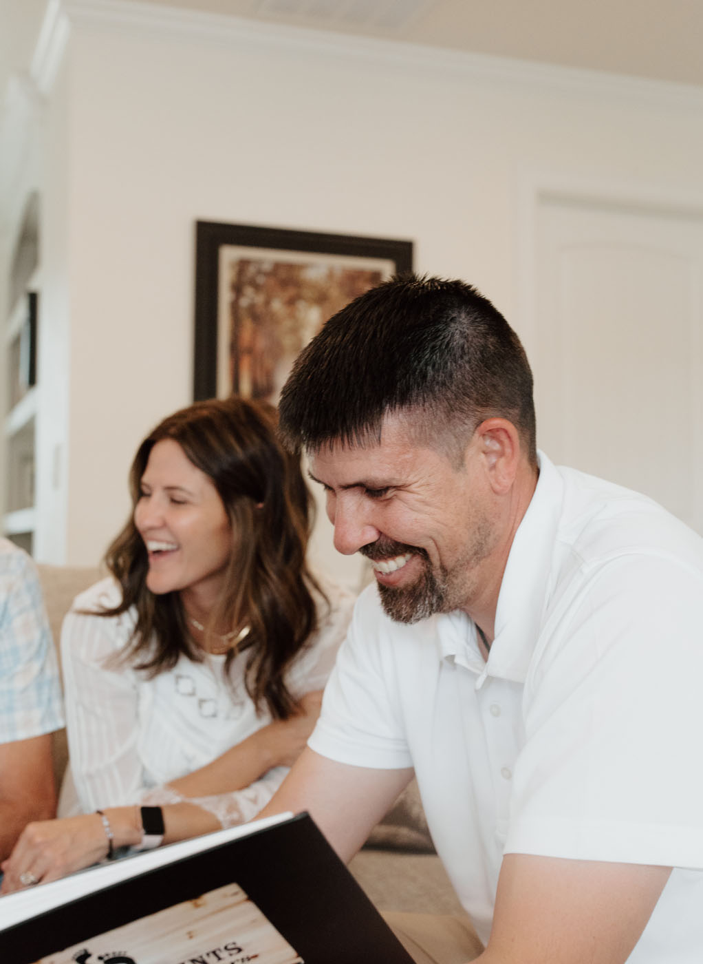 Happy customer smiling after seeing their recently completed bath remodel project in Broomfield / Boulder, CO.