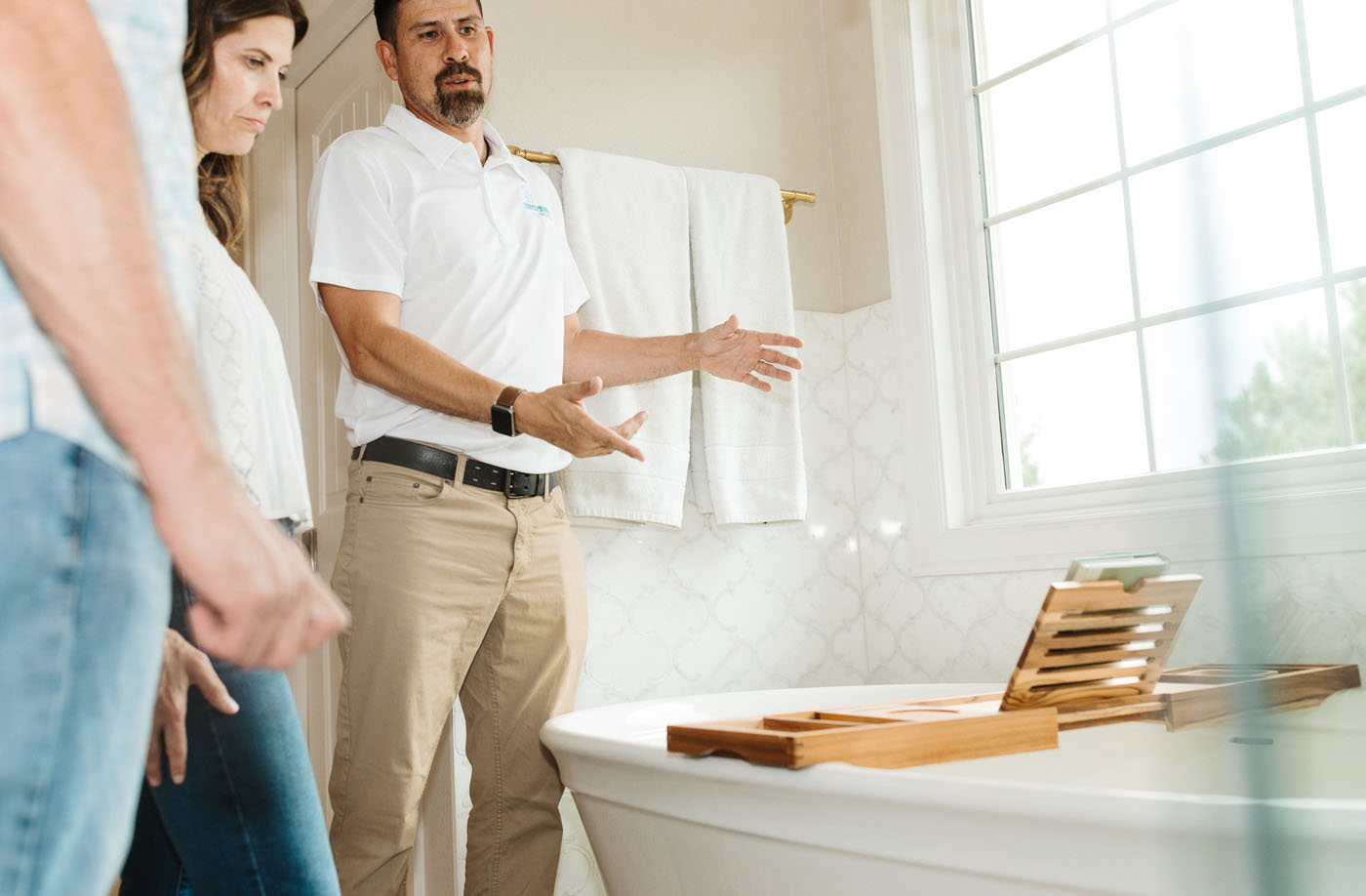 A Footprints Bath and Tile expert working with homeowners on their project - we are one of the leading bathroom remodel companies in Columbus, OH.