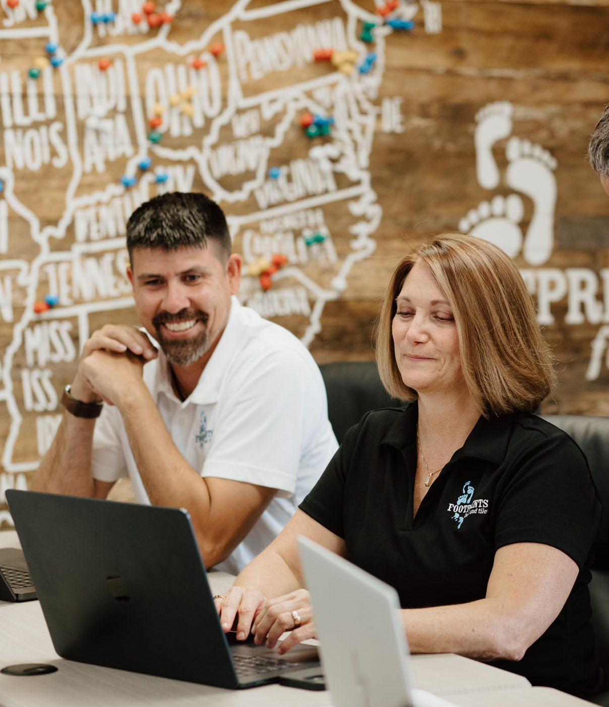 Footprints Bath and Tile team working in their corporate office.