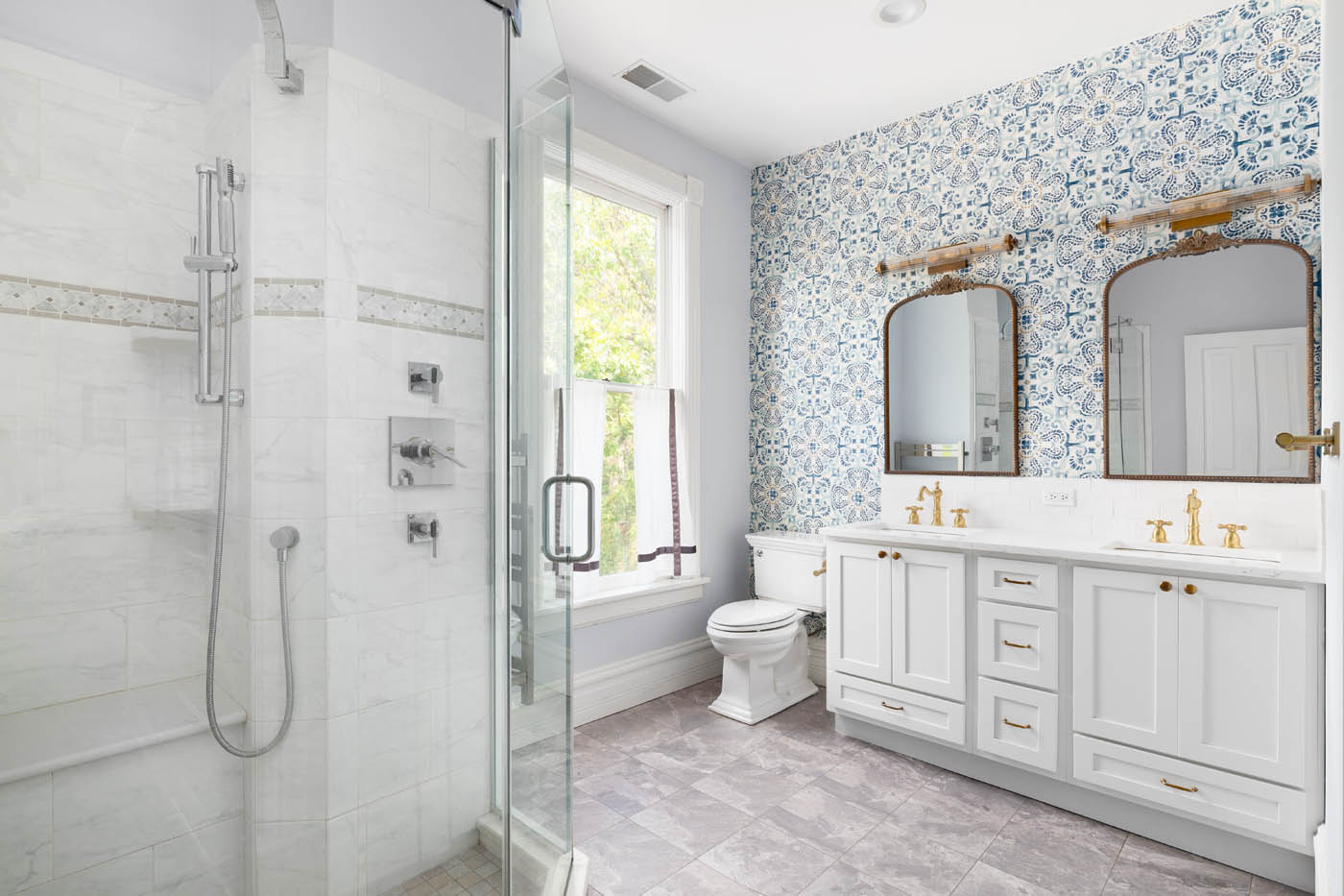 An image of a shower and beautiful vanity with tiled, mosiac walls - upgrade your vanity today with Footprints bathroom vanity installers in Atlanta, GA.