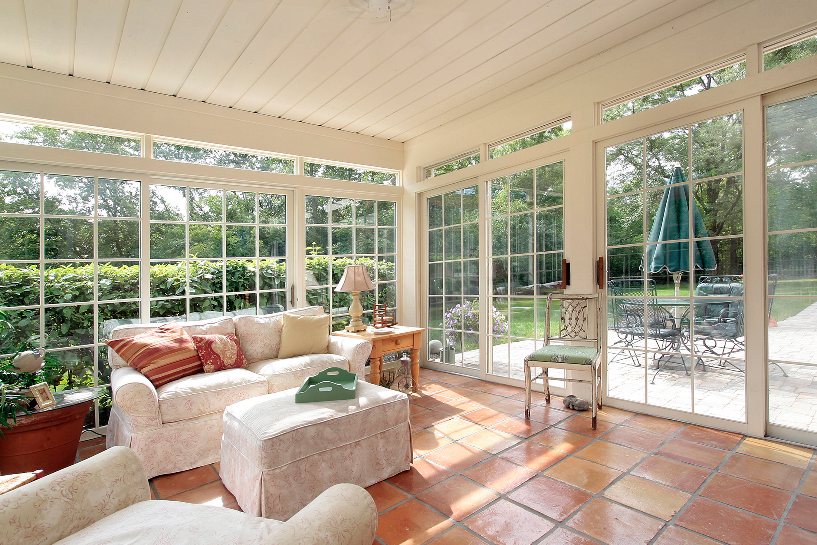 A closed-off porch with stylish tile from Footprints Bath and Tile.