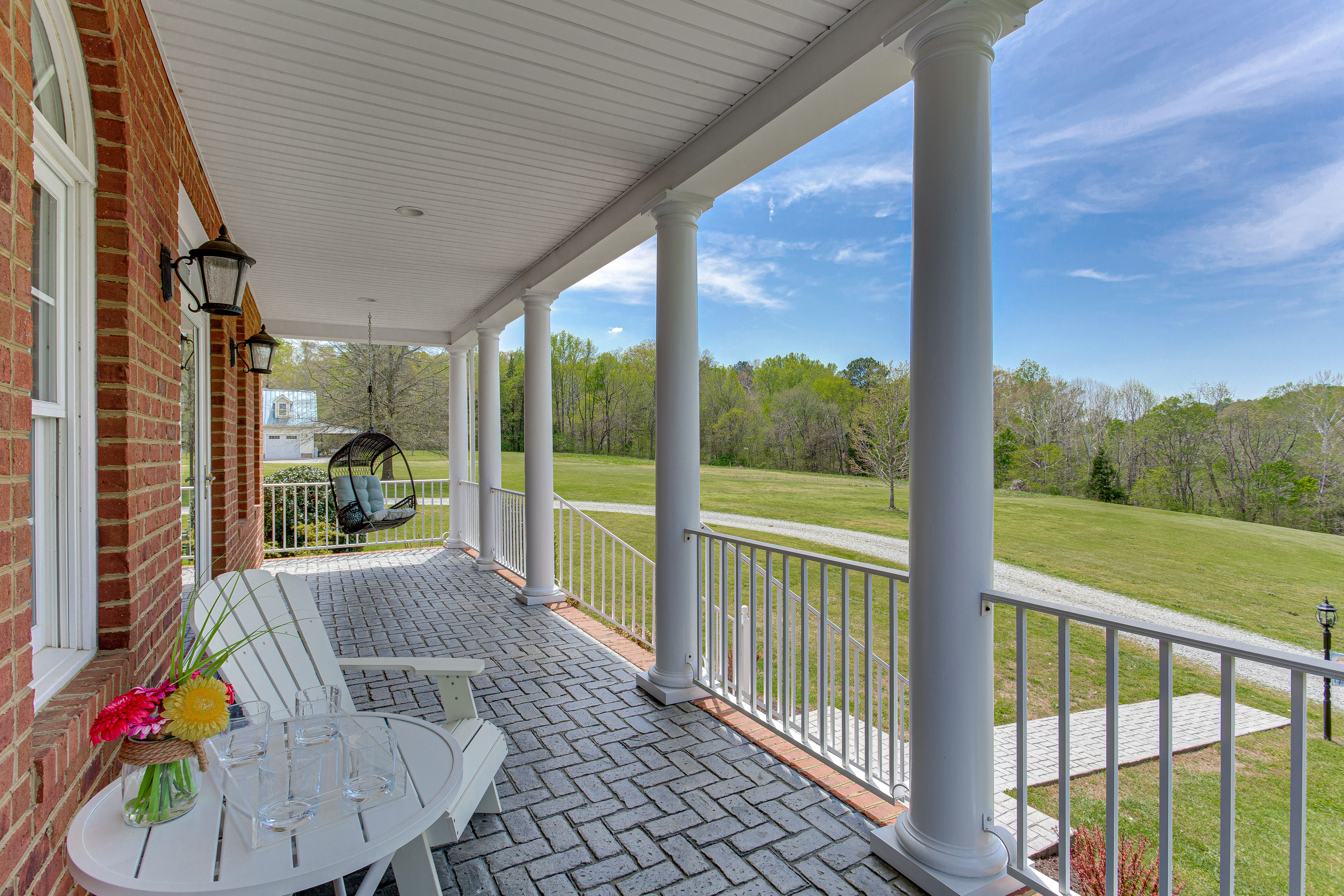 An image of a front porch wrap-around patio with tile.