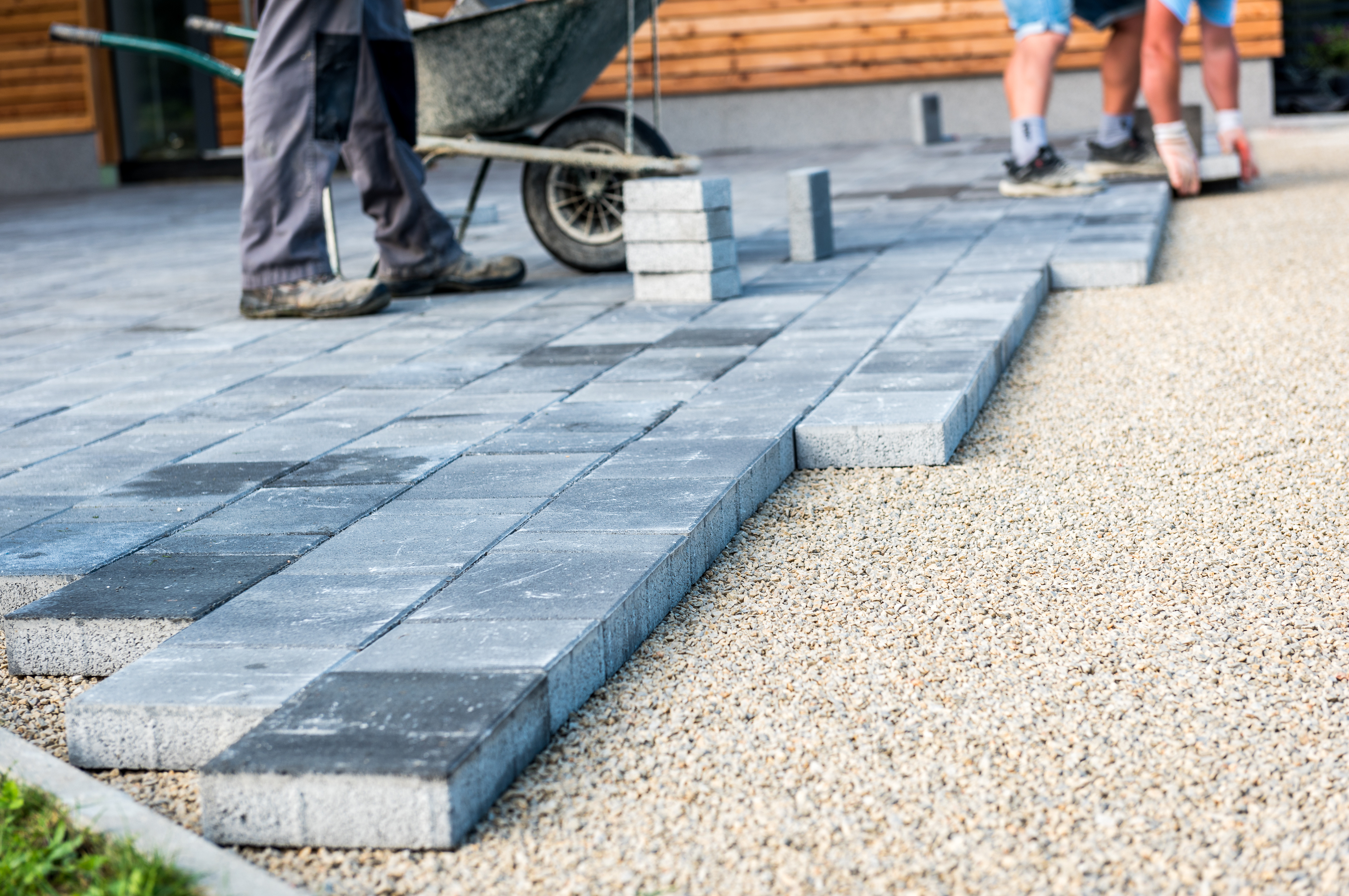 A Footprints Bath and Tile contractor installing patio tile.
